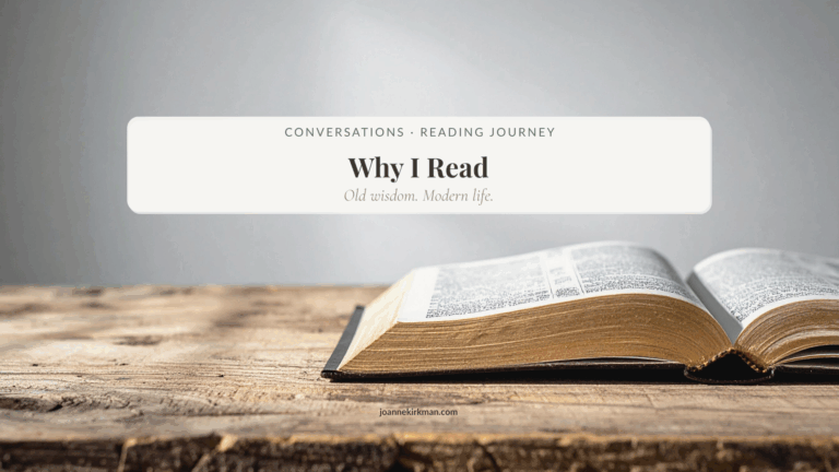 Open book in soft morning light on a wooden table, symbolising quiet reflection and learning.