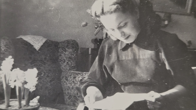 Featured image: Young woman reading books and love letters in Holland during the late 1940s.