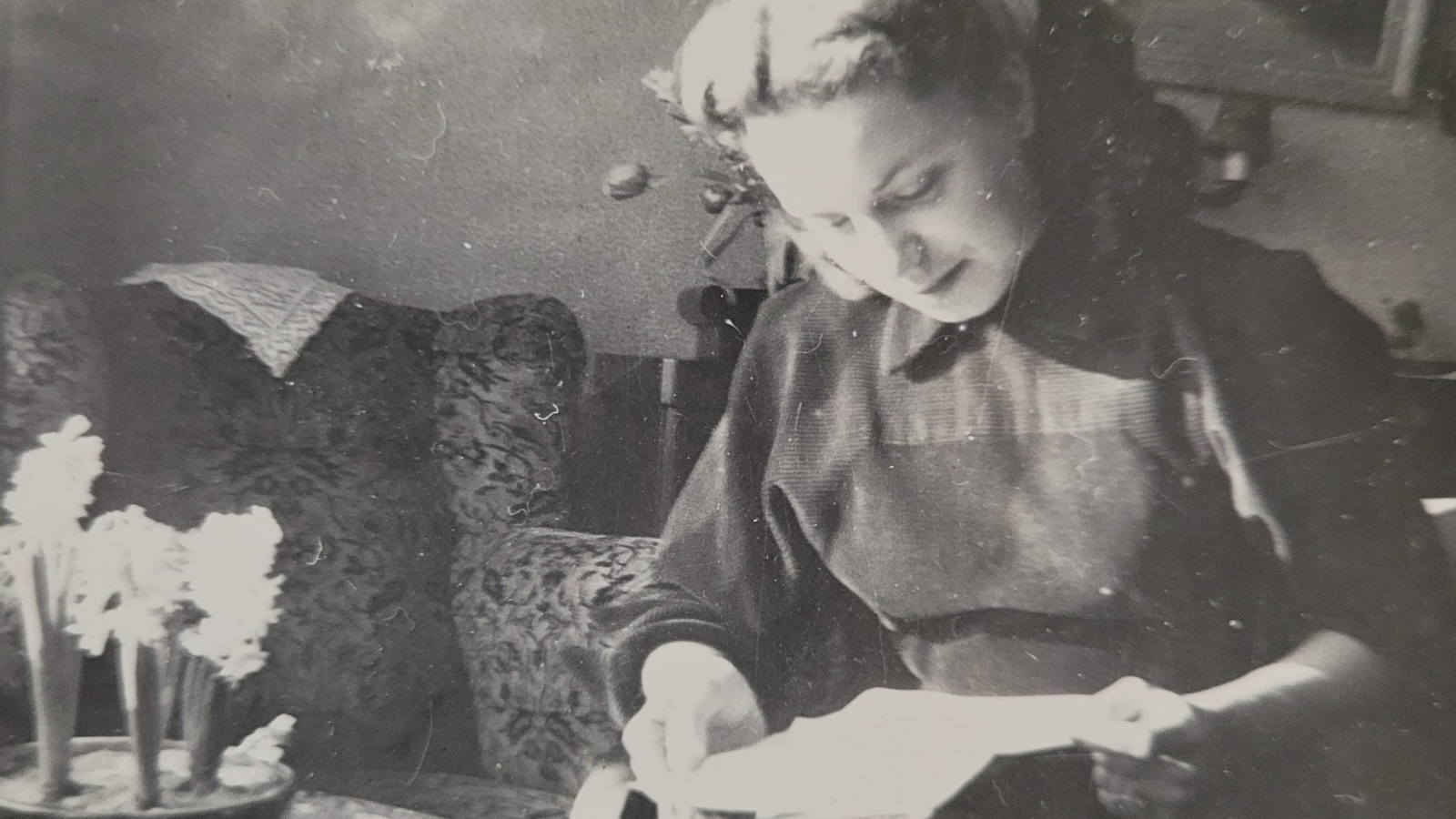 Featured image: Young woman reading books and love letters in Holland during the late 1940s.